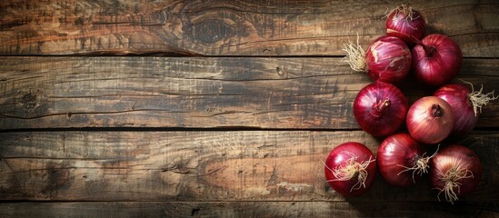 Poster - Old rustic wood table background with Spanish onions creates a picturesque setting for a copy space image