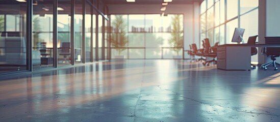 Wall Mural - An empty contemporary office interior with blurred background showing furniture and computers ideal for adding text or graphics in the copy space image