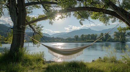 a tranquil nature setting with a cozy hammock strung between two trees, overlooking a calm river wit