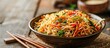 © meristock - Popular Indo Chinese dishes like Schezwan Noodles vegetable Hakka Noodles or chow mein are served in a bowl or plate with wooden chopsticks featuring a selective focus for copy space image