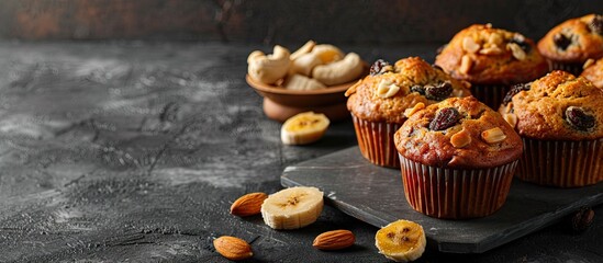 delicious homemade banana nut and raisin muffins with copy space image