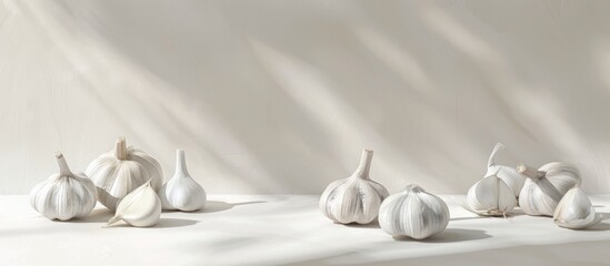 Garlic arranged on a white backdrop with copy space image