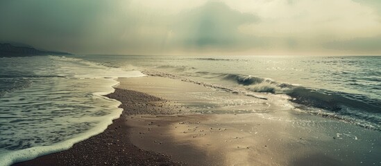 Poster - The beach and sea appear dreamy and nostalgic in the twilight or evening evoking a vintage and fantasy ambiance perfect for a copy space image