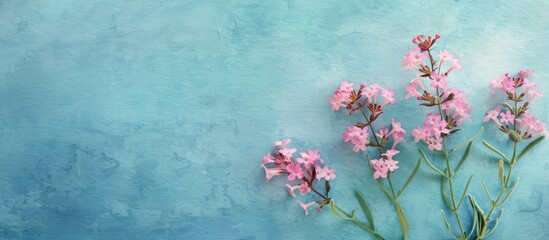 Poster - Wavyleaf sea lavender also called Limonium sinuatum displays sea pink flowers against a blue watercolor backdrop with a blank card in the copy space image