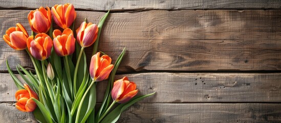 Poster - Mother s Day concept with orange tulips on vintage wooden boards providing a lovely copy space image