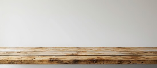 Aufkleber - A wooden table resting against a white wall creates a simple and elegant backdrop for any object with ample copy space image