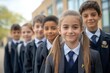 © BogdanNikolic - A group of happy young students in uniform posing for the camera outside their school