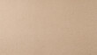 © Arthur - Close-Up of Textured Natural Kraft Paper Surface with Visible Fibers and Subtle Imperfections in a Neutral Beige Tone. Eco-Friendly Packaging, Craft Projects, Organic Branding Backgrounds