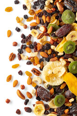 Wall Mural - Dried tropical fruits, nuts, and raisins isolated on white.