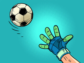 The goalkeeper's hand tries to catch the soccer ball. Football sporting events. Catch the ball and succeed.