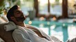 © Cambo27 - Relaxed young man in a spa robe, unwinding in a luxurious spa environment