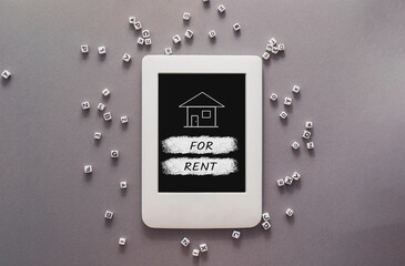 Wall Mural - A tablet with a house on it and the words for rent written below it