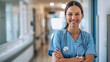 © Sourov - A smiling nurse standing confidently in a hospital corridor, holding a stethoscope