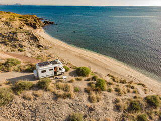 Sticker - Caravan with solar panels on roof camp on sea, Spain. Aerial view.