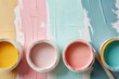 © netrun78 - A collection of open paint cans in a variety of pastel colors with brushes, set for any creative painting project or home renovation..