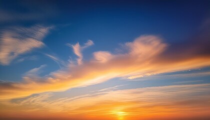 Wall Mural - sunset with cirrus clouds beautiful cloud patterns at dusk sunrise orange clouds in the sky sky background sky gradient twilight heaven nature blue sky