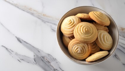 homemade cookies in a bowl on the white marble table