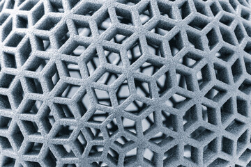 Leinwandbilder - A close up of a grey object with a lot of holes. The object is made of a material that is not very dense