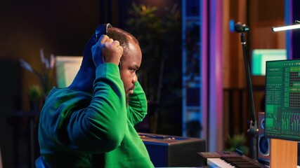 Leinwandbilder - Music composer adding tracks as sound effects for a new song, recording sounds on electronic piano synthesizer. Songwriter audio technician editing and mixing tunes on software. Camera A.