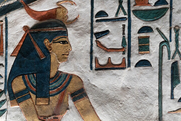 A relief showing an Egyptian goddess in Nefertari tomb. selective focus.