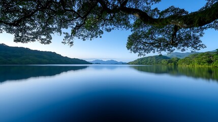 Wall Mural - serene lakeside view at sunrise, featuring the soft glow of morning light reflecting on calm waters,