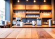 © Naluphon - Wooden Tabletop with Blurred Cafe Background.