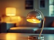 © Natalia - Retro chrome and glass table lamp with a minimalist design, softly glowing in a stylish 1960s living room