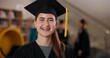 © Nina2024/peopleimages.com - Portrait, student and happy girl at graduation in university for future success or learning achievement. Face, woman and college graduate with education milestone, pride or laugh for mba scholarship