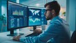 © Ndoomyim - Focused Financial Analyst Working on Multiple Monitors