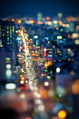 Wall Mural - A vibrant cityscape at night with tiny lights and buildings, enhanced by the tilt-shift effect. 