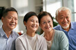 © imtmphoto - two happy senior asian couples watching tv together at home