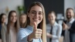 © CYBERUSS - A CEO or Business manager giving a thumbs up, Congratulation concept with employee in a modern office, Happy teamwork members around, emphasizing positive feedback and encouragement.