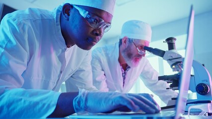 research chemists analyzing data in innovative laboratory with advanced equipment