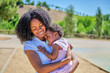 © ADDICTIVE STOCK - African American mother and daughter sharing a loving embrace