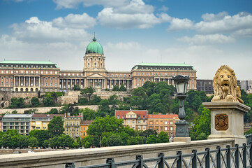 Sticker - Lion sculptures of the Chain Bridge with the view of  Royal palace of Buda in  Budapest, Hungary