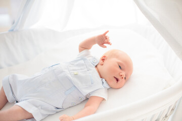 Wall Mural - Little baby on white bed