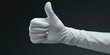 © Alexandr - Hand with Thumbs Up Glove