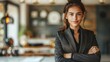 © Рудой Максим - Confident woman in a stylish outfit poses in a modern cafe during the day