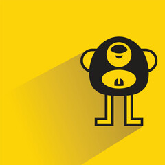 Wall Mural - cute monster icon with shadow on yellow background