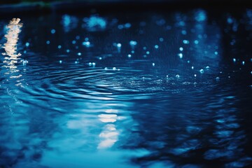 Wall Mural - Ripples and Raindrops on a Deep Blue Water Surface