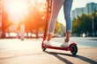 © July P - A woman rides an electric scooter through the city.