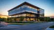 © Siasart Studio - Modern office building at dusk with landscaped grounds.