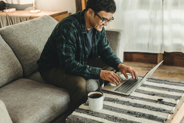 Wall Mural - asian man work using computer hand typing laptop keyboard contact us.student study learning education online.adult professional people chatting search at office.concept for technology device business