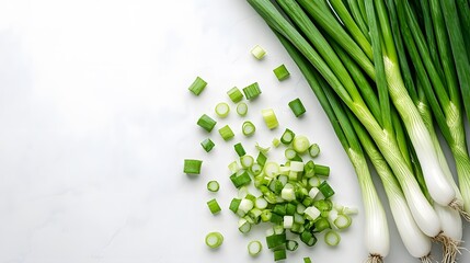 Wall Mural - Fresh green onions on white marble countertop, whole and chopped scallions, vibrant green color, culinary ingredients, clean white background, high contrast, food photography.