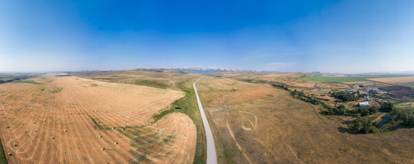 Wall Mural - Dirt Road in Country side by farms. Alberta, Canada.