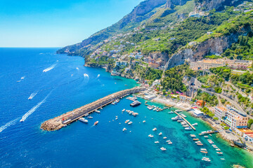 Wall Mural - Amalfi on Amalfi Coast, Italy. Aerial photo of famous city Amalfi located on Amalfi Coast with blue sea water and beautiful colorful houses on the cliff