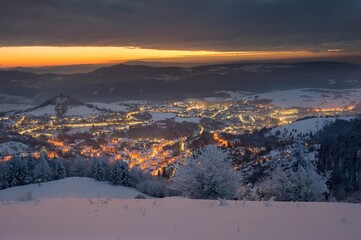 Wall Mural - Blue winter morning in old romantic city. Wonderful, romantic winter mood in the city. Beautiful Christmas wallpaper. Winter night in Banska Stiavnica