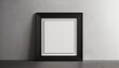 © Arber - Single blank vertically oriented rectangular picture frame with thin white border hanging on white wall. 3D illustration.