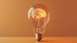 © sambath - A light bulb with a brain inside, symbolizing a bright idea.