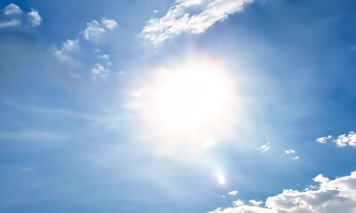 low angle timelapse bright sun on blue summer sky with moving fluffy clouds, sun shining sunbeams, w